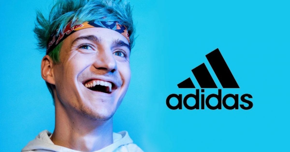 A man wearing a headband smiling for an adidas campaign